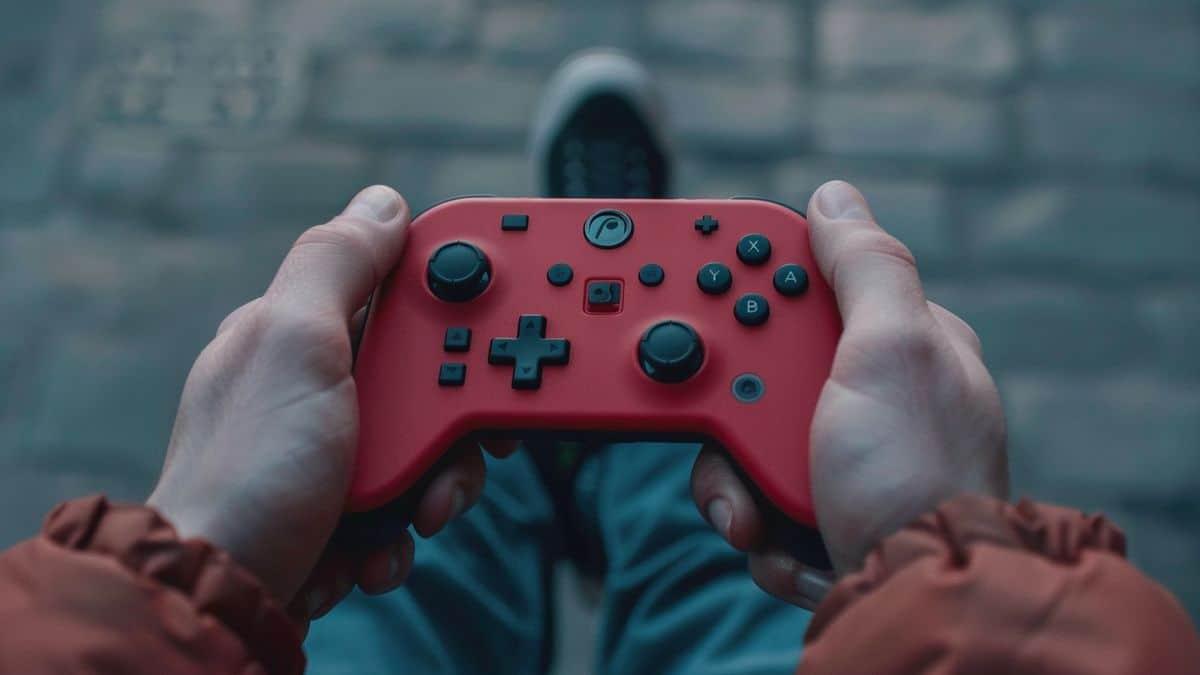 Closeup of a gamer's hands holding the Switch Pro Controller during gameplay.