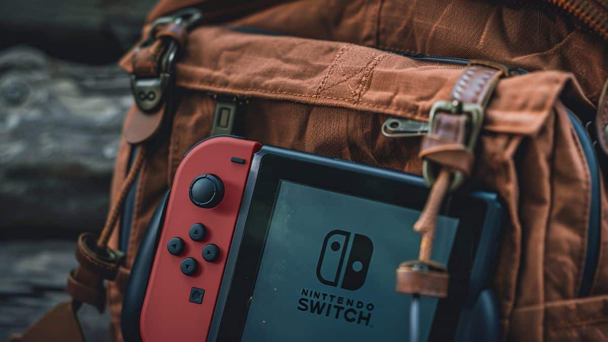 Nintendo Switch in a backpack pocket, ready for travel with USBC cable visible.