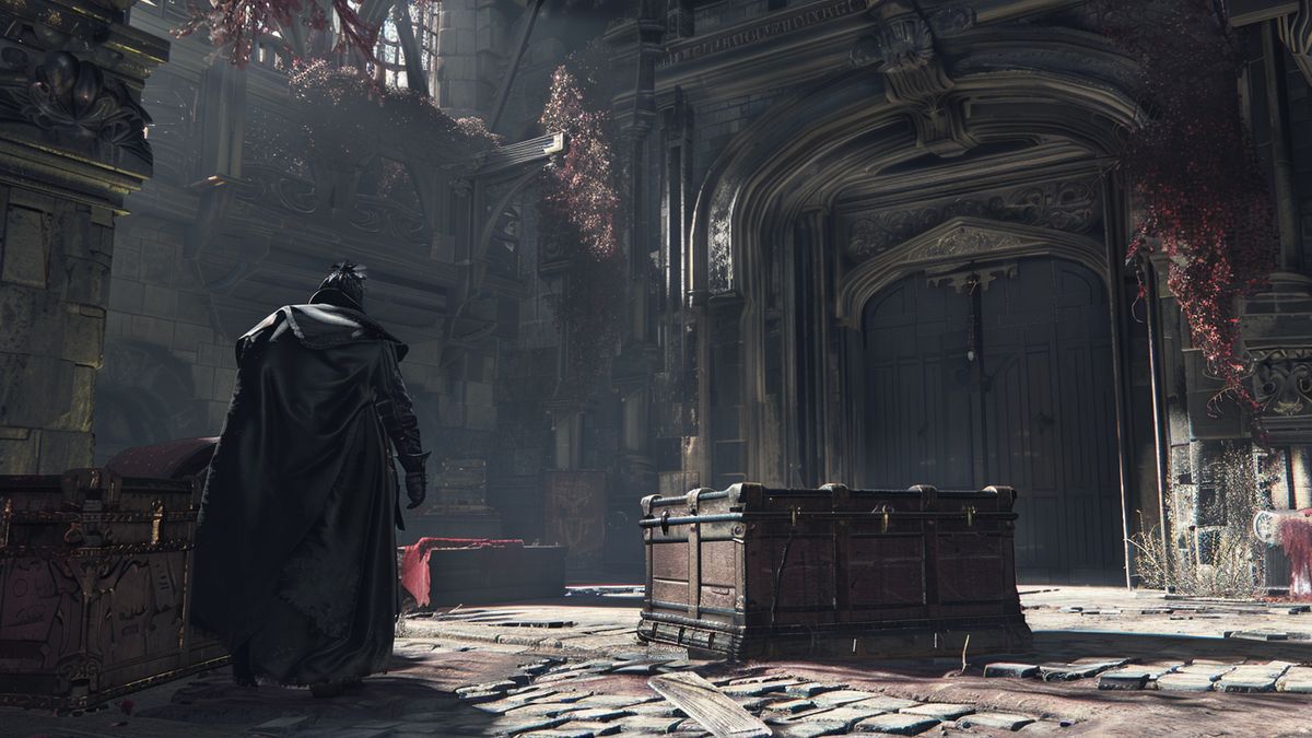 Una PS polvorienta con el icónico estuche del juego Bloodborne al lado.